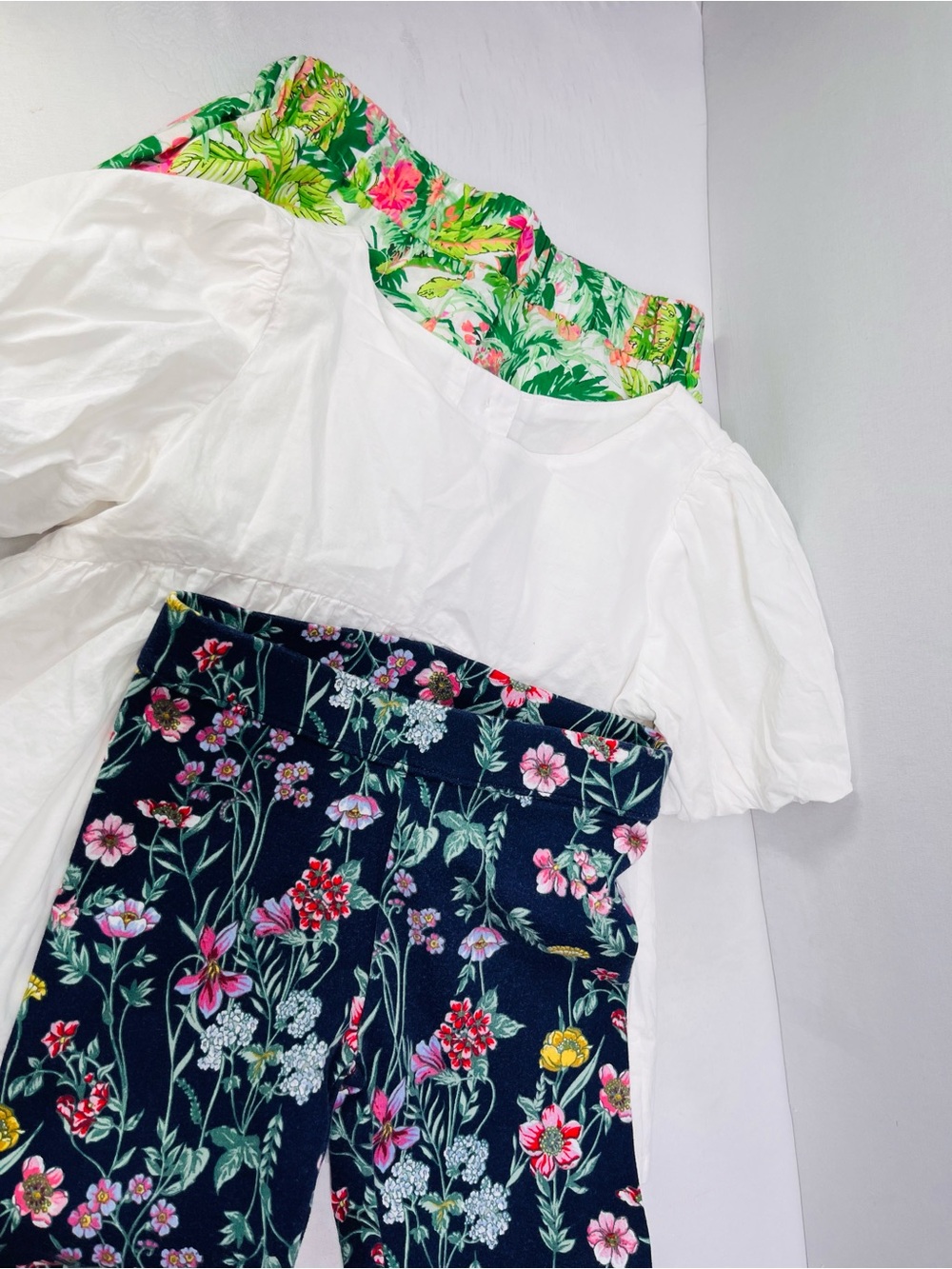 White Puff Sleeve Top with Floral‎ Navy Pants and ruffled floral shorts